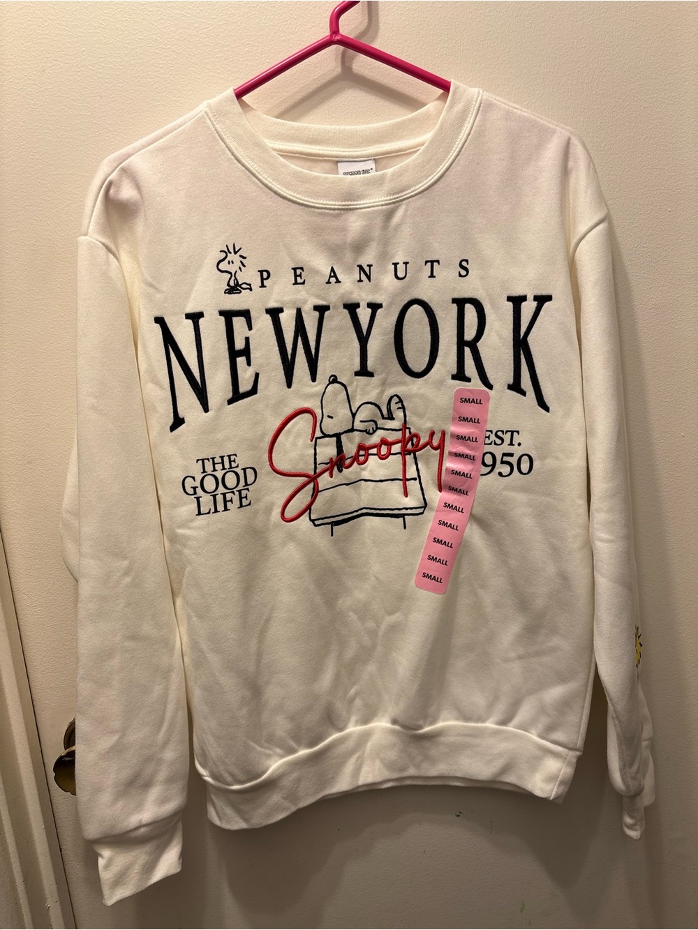 Peanuts Cream New York Snoopy Graphic Sweatshirt with Red Script